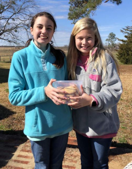Gallery riders and youth handlers Addison McDuffie and Claire Street sharing their baking skills at the field trial